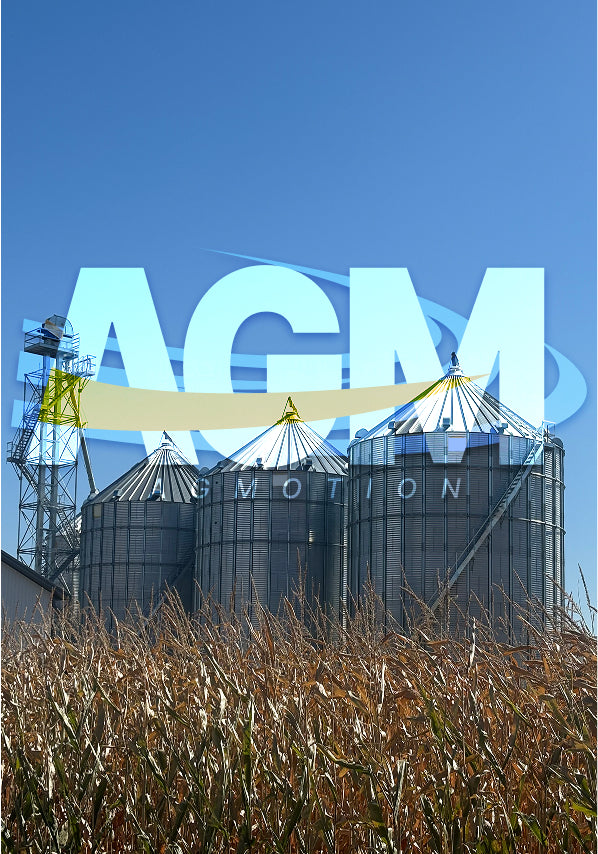 3 grain bins blue sky on corn field