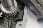 Close-up of a mechanical component with gears and metal parts.