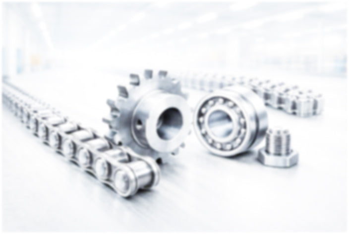 Metallic gears and bearings on a white background